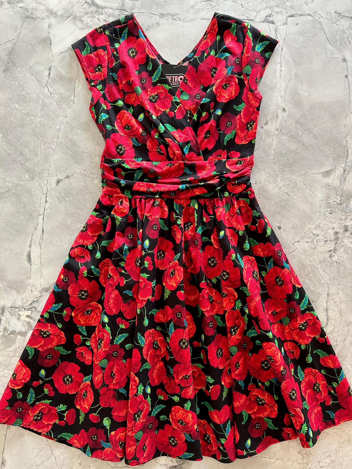 Vestido Greta con flor de amapola