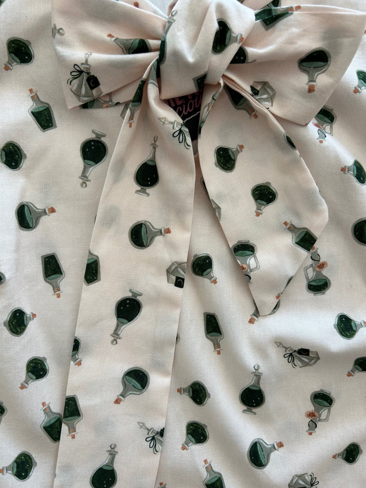 Top de lazo de pociones