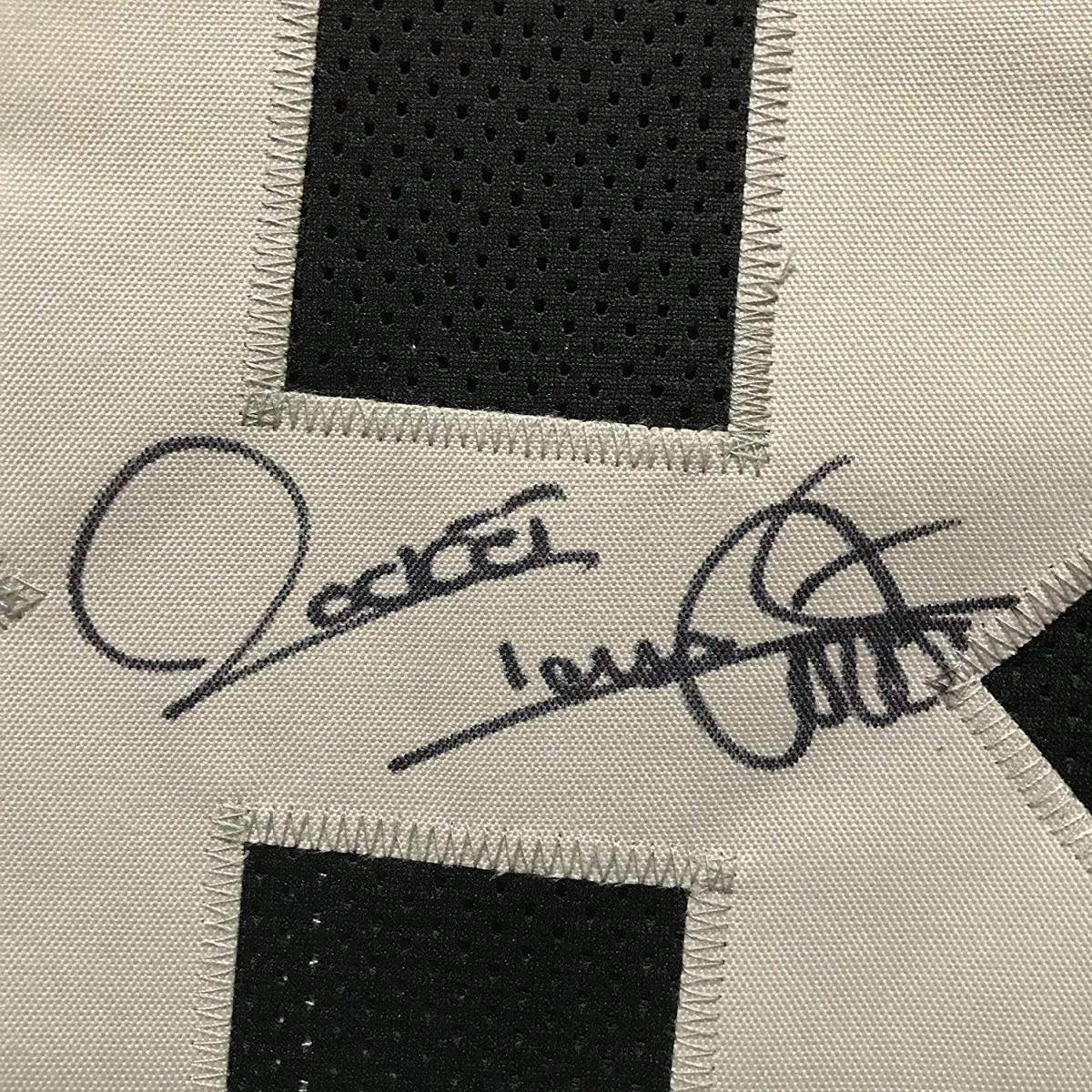 Camiseta de fútbol americano negra de los Oakland Raiders, enmarcada, autografiada y firmada por Raghib Rocket Ismail, 35 x 39, JSA COA