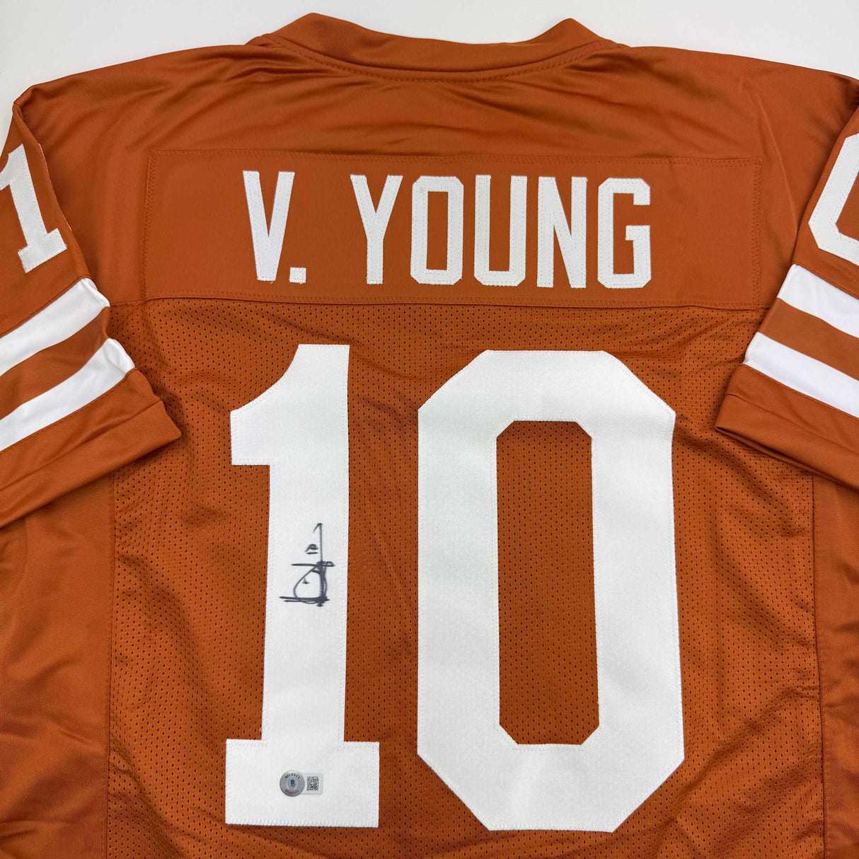 Camiseta de fútbol americano universitario Texas Orange autografiada/firmada por Vince Young Beckett BAS COA