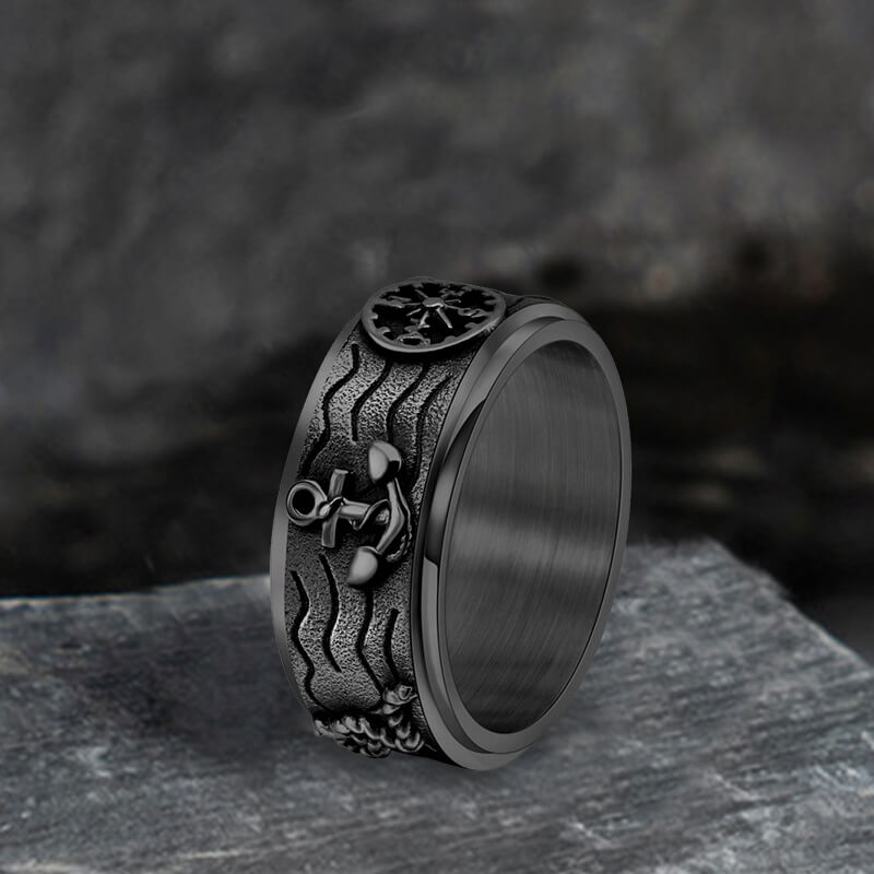 Anillo giratorio de acero inoxidable con brújula y ancla
