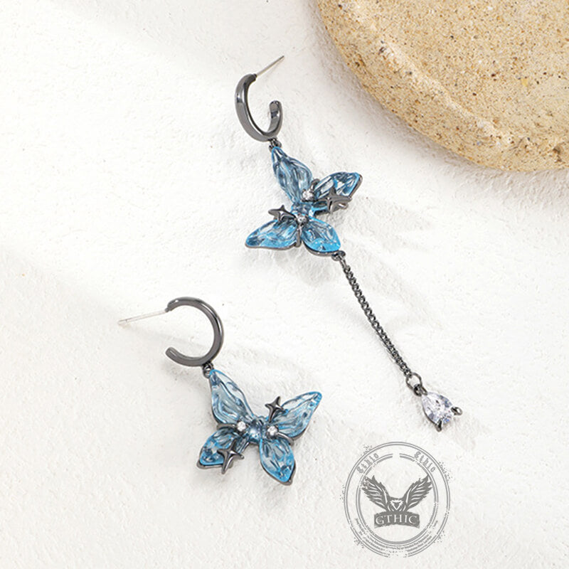 Pendientes colgantes asimétricos con borlas de mariposa azul