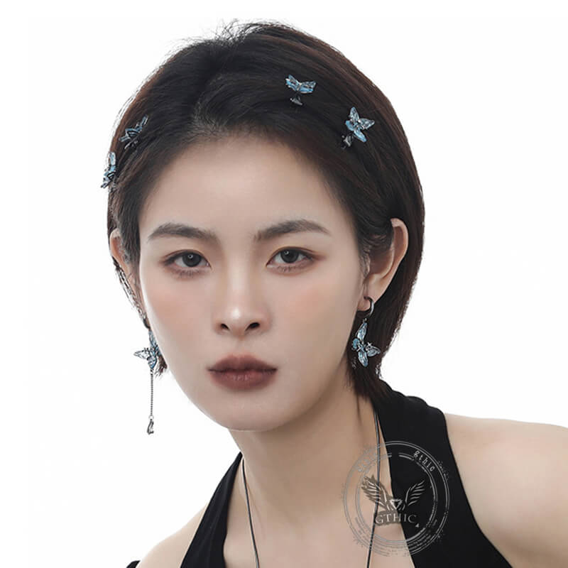 Pendientes colgantes asimétricos con borlas de mariposa azul