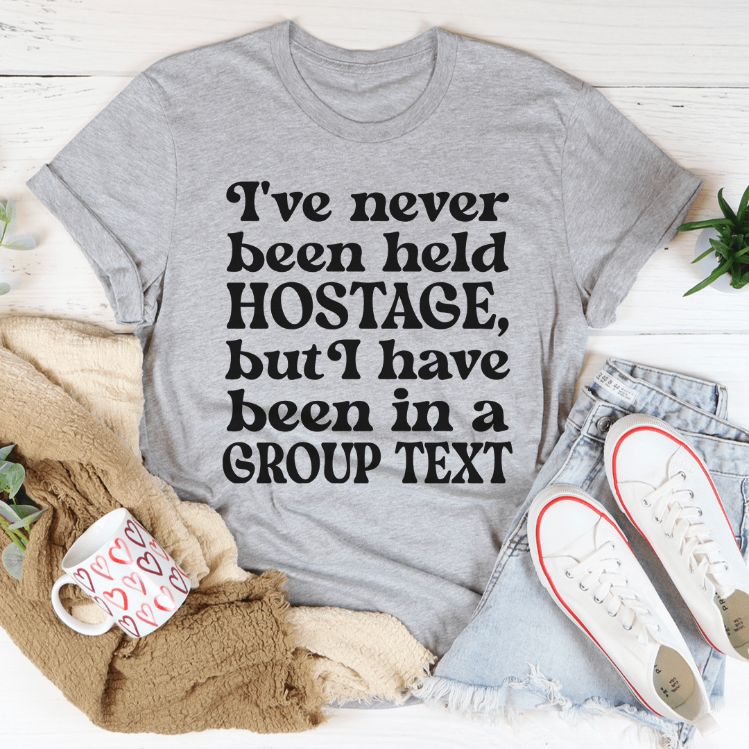 Camiseta con el texto "Nunca me han tomado como rehén, pero sí he estado en un grupo"