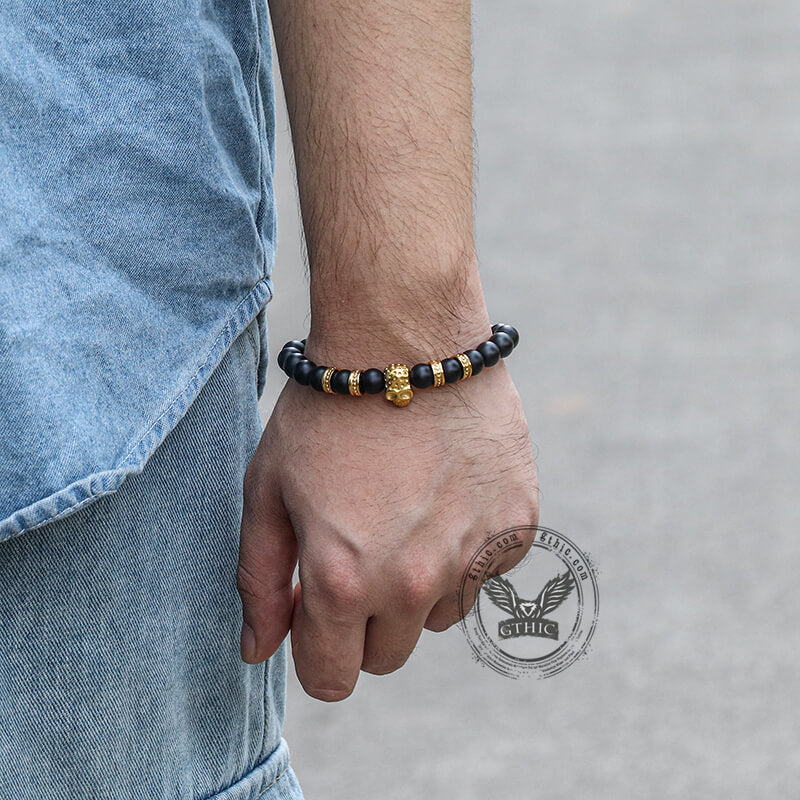 Pulsera de calavera de acero inoxidable con roca volcánica