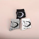 2 pares de calcetines con estampado de estrellas y lunas, cómodos y transpirables, medias de tubo medio para mujer.