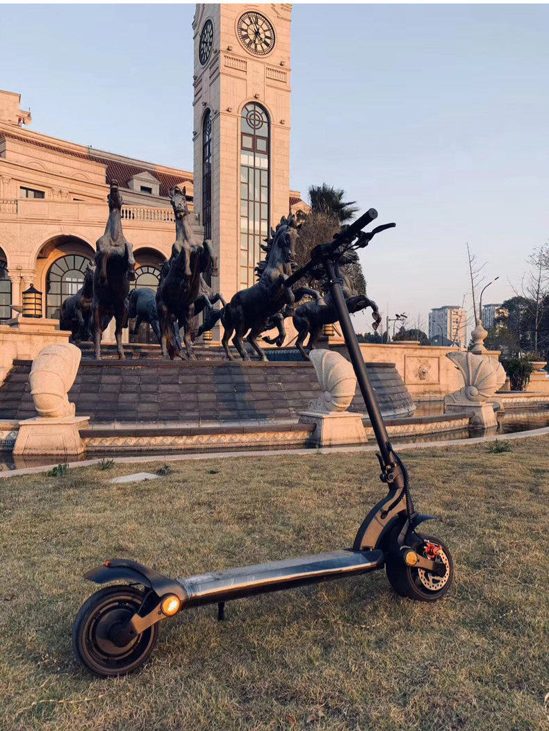 Patinete plegable de doble tracción con neumáticos anchos