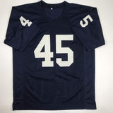 Camiseta de fútbol americano universitario azul autografiada/firmada de Rudy Ruettiger Never Quit Notre Dame JSA COA
