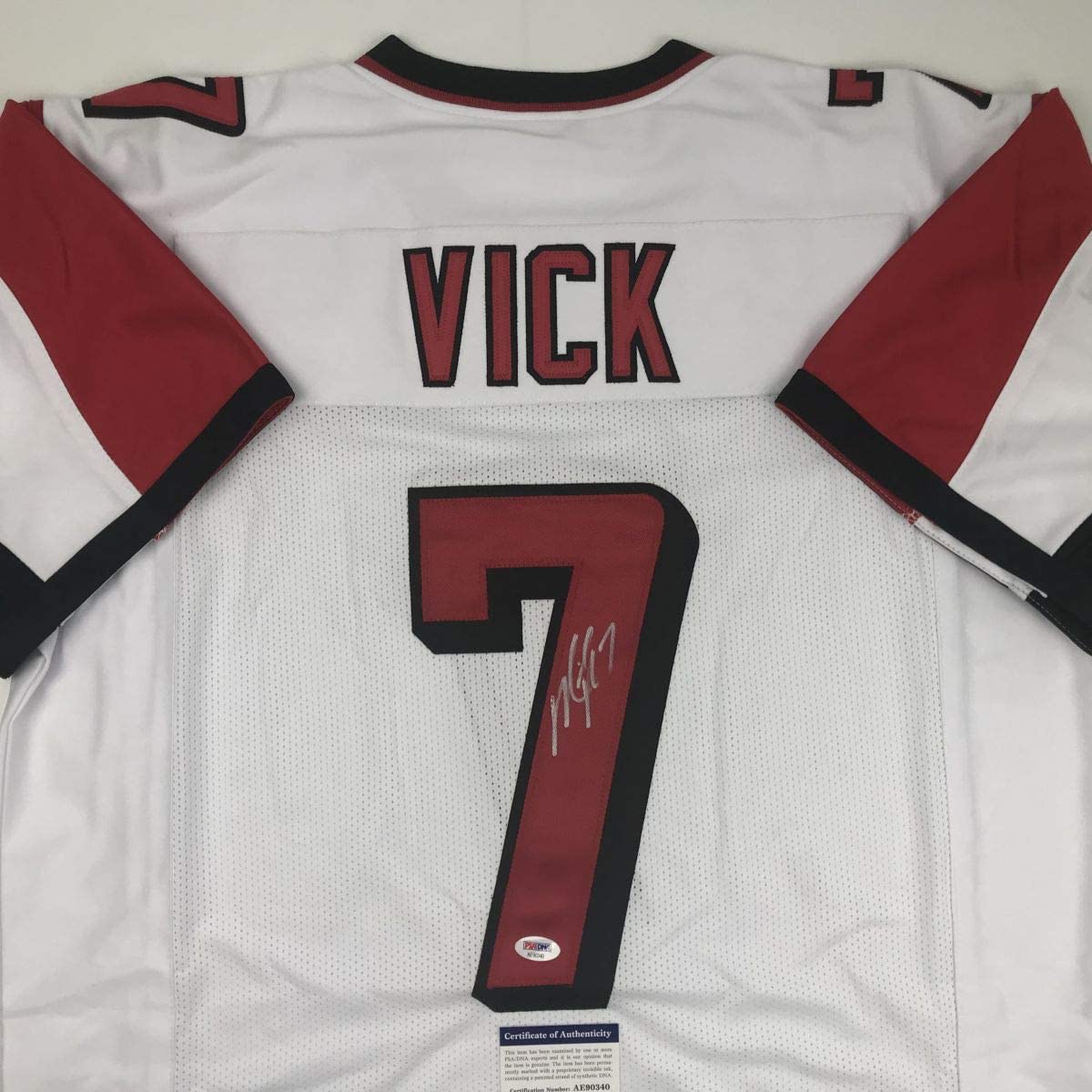 Camiseta de fútbol blanca de Atlanta autografiada/firmada de Michael Mike Vick. PSA/CÓDIGO DE ADN.