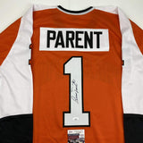 Camiseta de hockey naranja de Filadelfia autografiada/firmada por Bernie Parent (JSA COA)