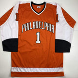 Camiseta de hockey naranja de Filadelfia autografiada/firmada por Bernie Parent (JSA COA)