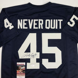 Camiseta de fútbol americano universitario azul autografiada/firmada de Rudy Ruettiger Never Quit Notre Dame JSA COA