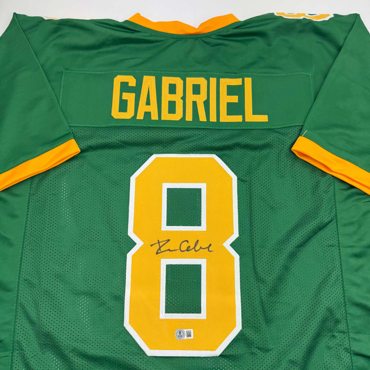Camiseta de fútbol americano universitario autografiada/firmada por Dillon Gabriel Oregon Green Beckett BAS COA