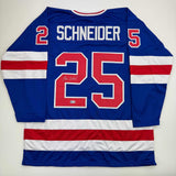 Camiseta de hockey azul autografiada/firmada de Buzz Schneider del equipo estadounidense Miracle On Ice de los Juegos Olímpicos de 1980, Beckett BAS COA