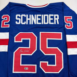 Camiseta de hockey azul autografiada/firmada de Buzz Schneider del equipo estadounidense Miracle On Ice de los Juegos Olímpicos de 1980, Beckett BAS COA