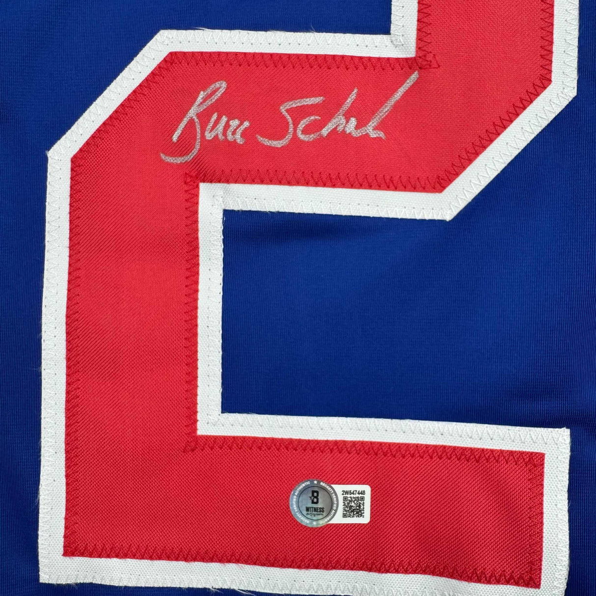Camiseta de hockey azul autografiada/firmada de Buzz Schneider del equipo estadounidense Miracle On Ice de los Juegos Olímpicos de 1980, Beckett BAS COA