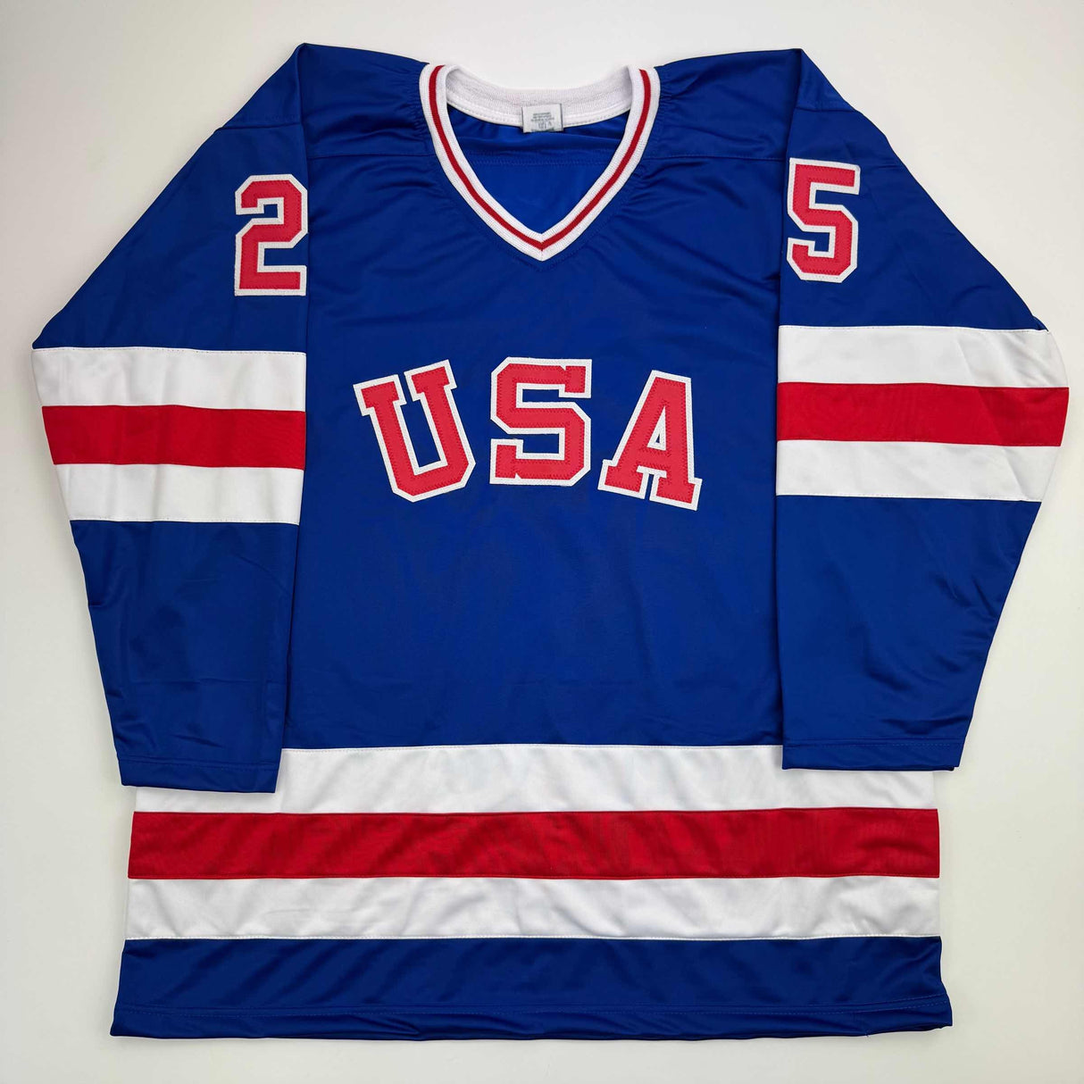 Camiseta de hockey azul autografiada/firmada de Buzz Schneider del equipo estadounidense Miracle On Ice de los Juegos Olímpicos de 1980, Beckett BAS COA