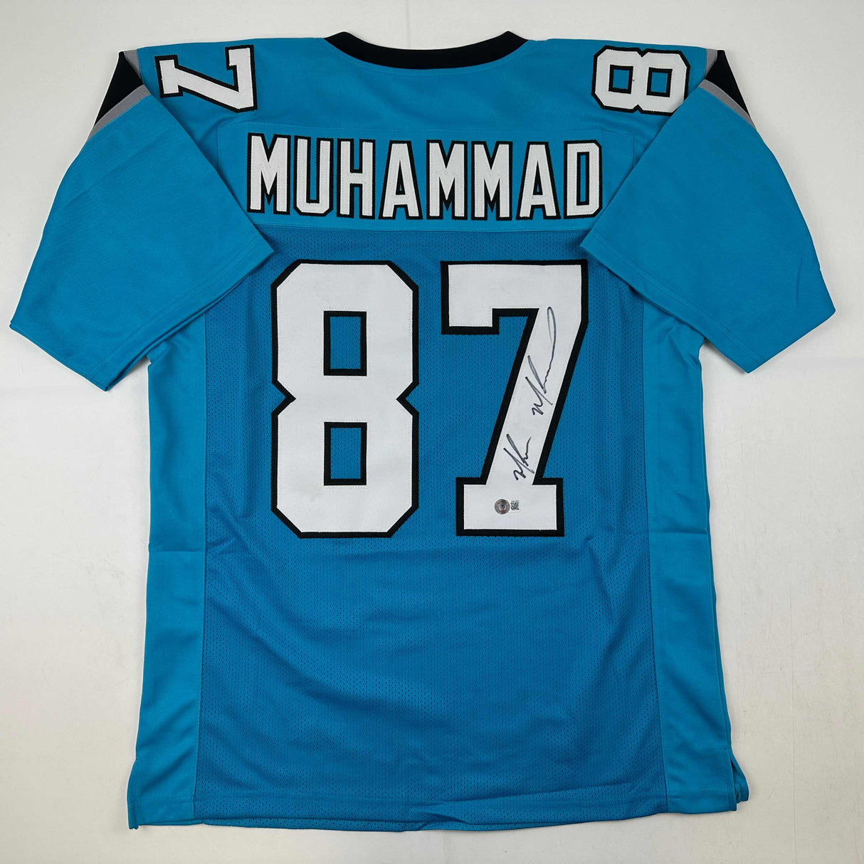 Camiseta de fútbol azul Carolina de Muhsin Muhammad autografiada/firmada Beckett BAS COA