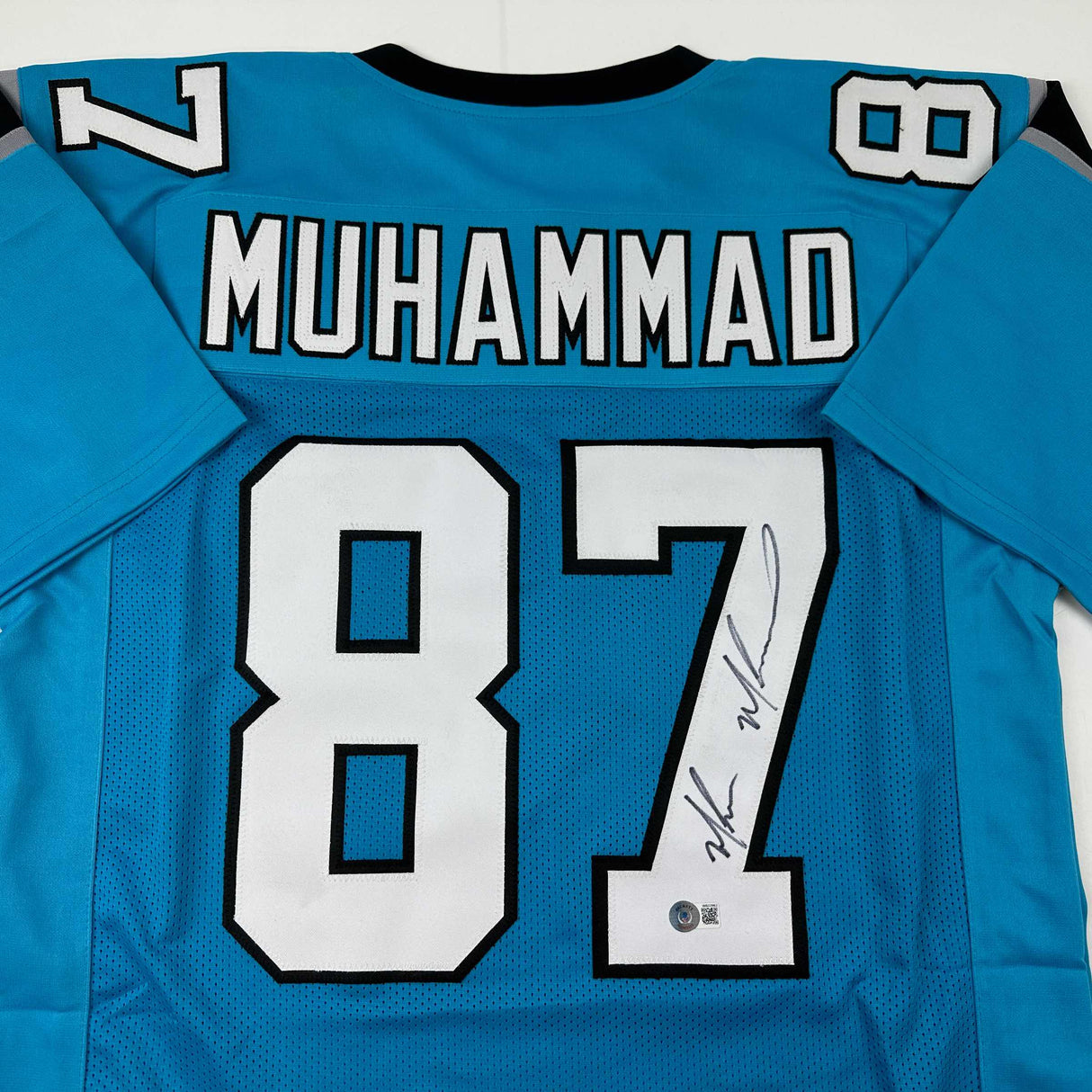 Camiseta de fútbol azul Carolina de Muhsin Muhammad autografiada/firmada Beckett BAS COA