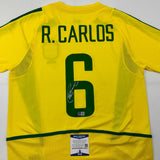 Camiseta de fútbol amarilla de Brasil autografiada/firmada de Roberto Carlos Beckett BAS COA