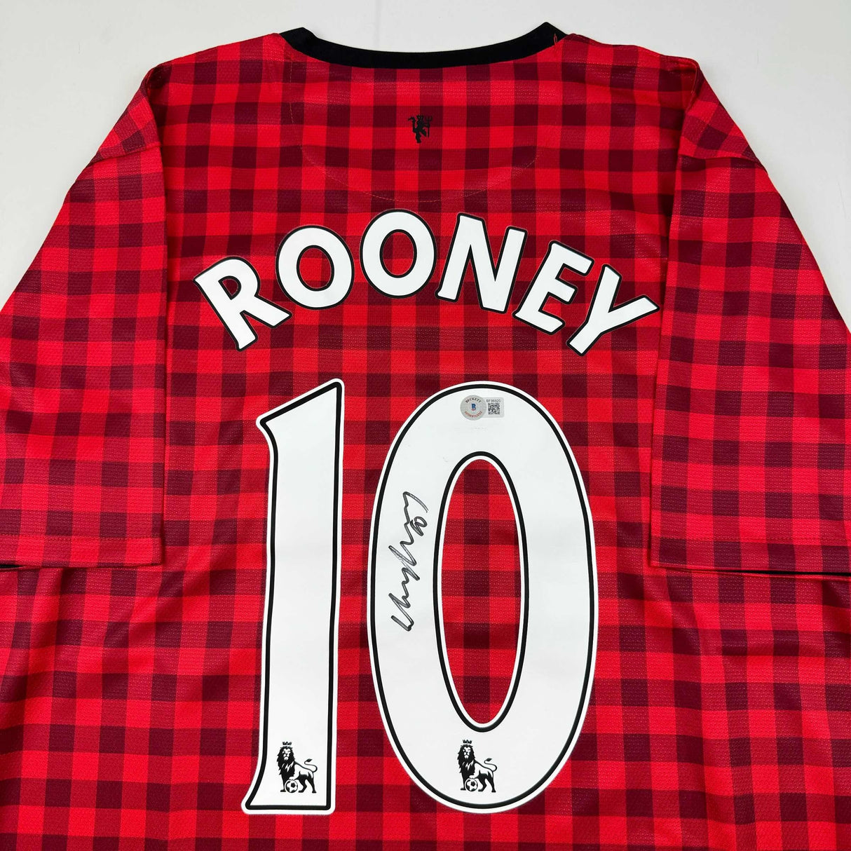 Camiseta de fútbol a cuadros roja del Manchester United autografiada/firmada por Wayne Rooney Beckett BAS COA