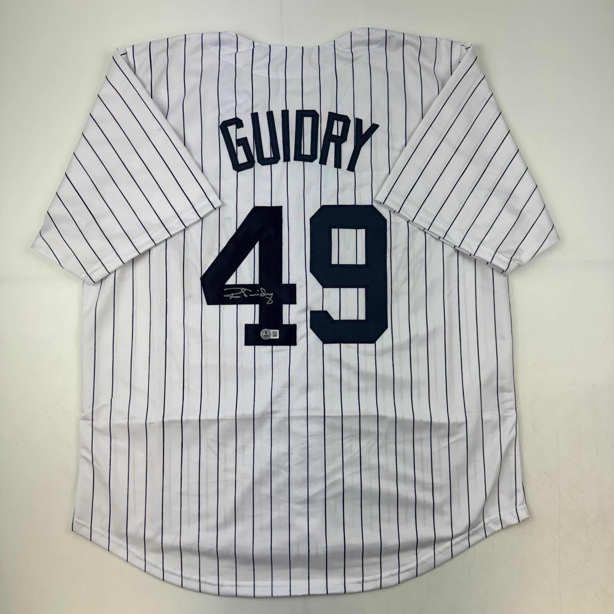 Camiseta de béisbol a rayas de Nueva York autografiada/firmada por Ron Guidry Beckett BAS COA