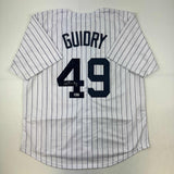 Camiseta de béisbol a rayas de Nueva York autografiada/firmada por Ron Guidry Beckett BAS COA