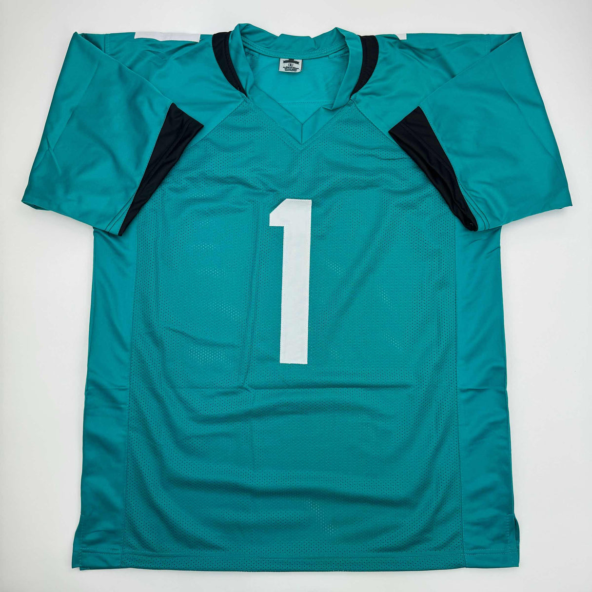 Camiseta de fútbol americano autografiada/firmada de Travis Etienne Jr. Jacksonville Teal Beckett BAS COA