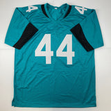 Autographed/Signed Travon Walker Jacksonville Teal Football Jersey Beckett BAS COA