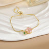 Pulsera sencilla de cobre puro chapada en oro con flores giratorias que conserva el color