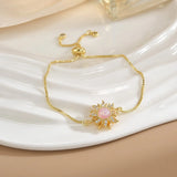 Pulsera sencilla de cobre puro chapada en oro con flores giratorias que conserva el color