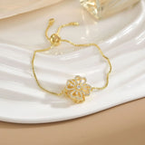 Pulsera sencilla de cobre puro chapada en oro con flores giratorias que conserva el color