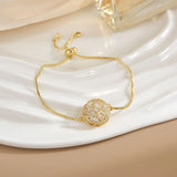 Pulsera sencilla de cobre puro chapada en oro con flores giratorias que conserva el color