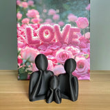 A family decorated wedding statue for three people, perfect as an anniversary gift for husband and wife, newlyweds, or as an art