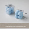 Une bougie parfumée en forme de boule carrée, un cadeau d'anniversaire coloré, une bougie artisanale et une bougie parfumée de forme mignonne