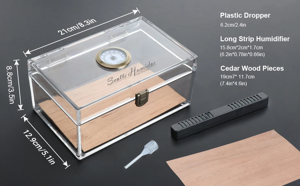 Boîte à cigares Scotte en acrylique avec hygromètre et humidificateur pour 20 cigares. Comprend un coupe-cigare et des accessoires pour perforer les cigares.