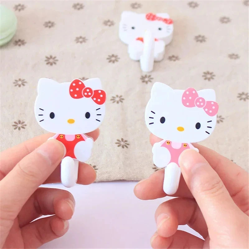 Juego de 2 ganchos adhesivos de pared Sanrio Hello Kitty con dibujos animados, resistentes y autoadhesivos, para cocina, baño, accesorios de almacenamiento para el hogar.