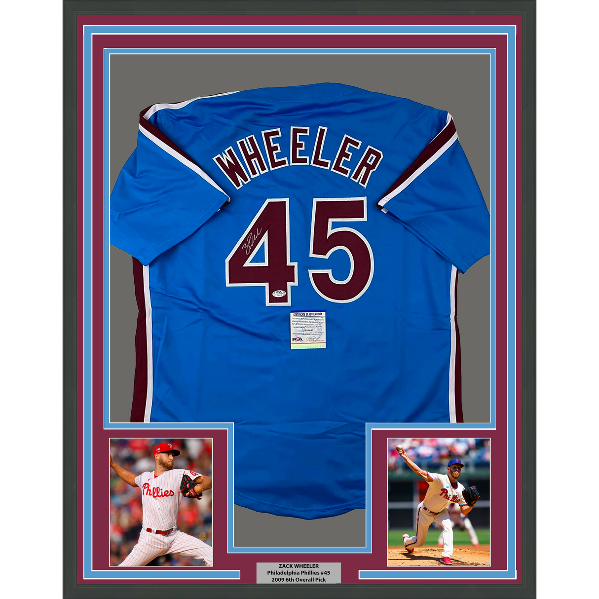 Camiseta de béisbol retro azul de Filadelfia de 35 x 39, enmarcada, autografiada y firmada por Zack Wheeler. Certificado de autenticidad de PSA y ADN.