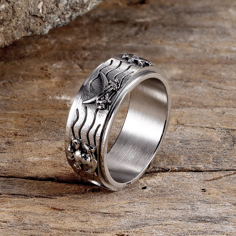 Anillo giratorio de acero inoxidable con brújula y ancla