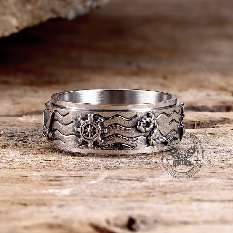 Anillo giratorio de acero inoxidable con brújula y ancla