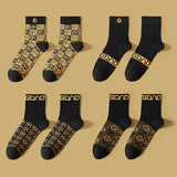 4 pares de calcetines geométricos de moda para hombre: mezcla de algodón suave, transpirables y cómodos. Calcetines unisex casuales y versátiles para exteriores en todas las estaciones.