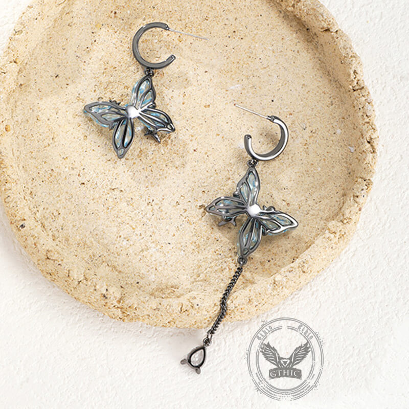 Pendientes colgantes asimétricos con borlas de mariposa azul