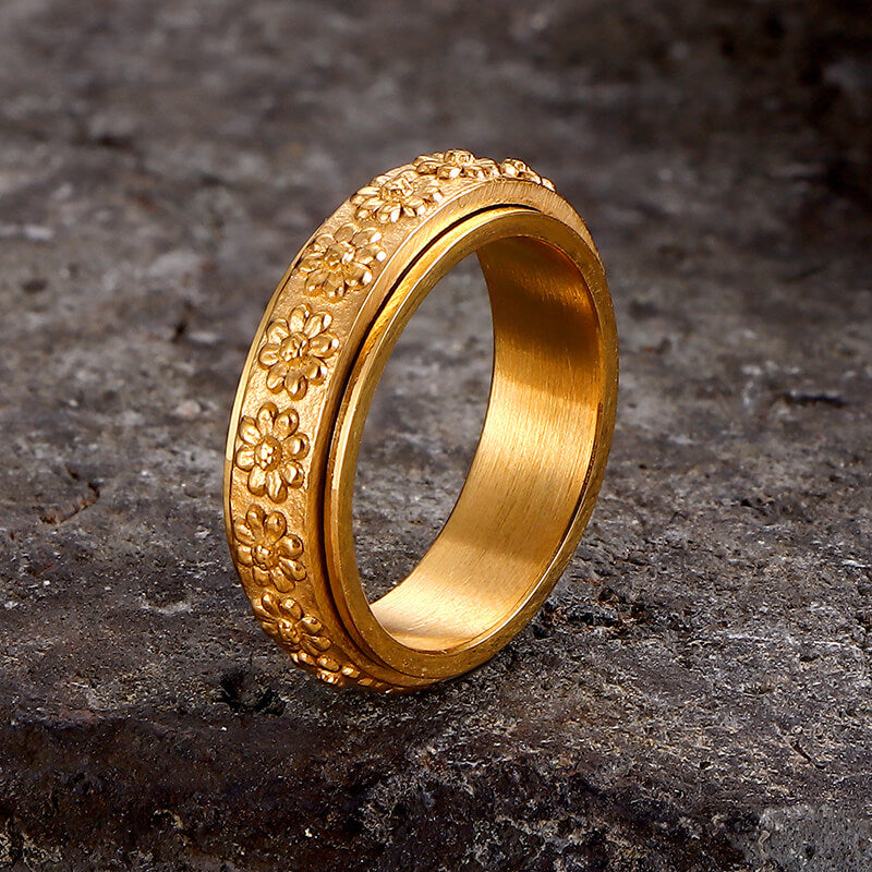 Anillo giratorio de acero inoxidable con diseño de margaritas sencillas