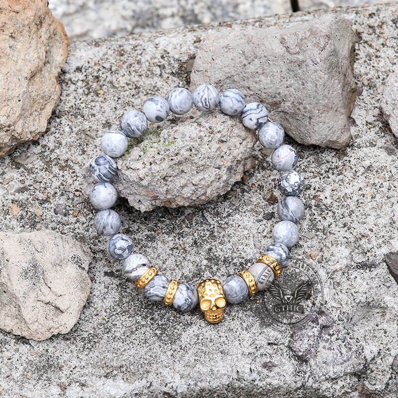 Pulsera de calavera de acero inoxidable con roca volcánica