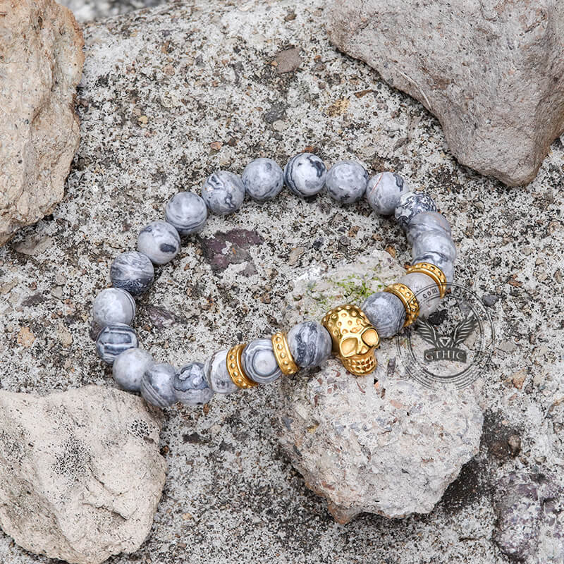Pulsera de calavera de acero inoxidable con roca volcánica