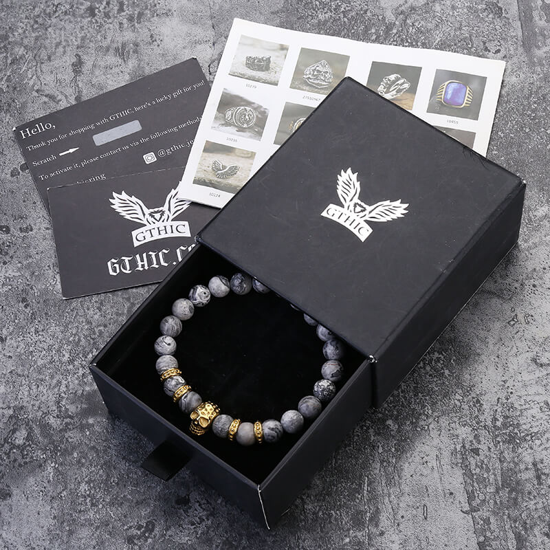 Pulsera de calavera de acero inoxidable con roca volcánica