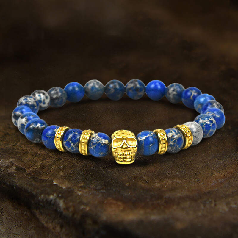 Pulsera de calavera de acero inoxidable con roca volcánica